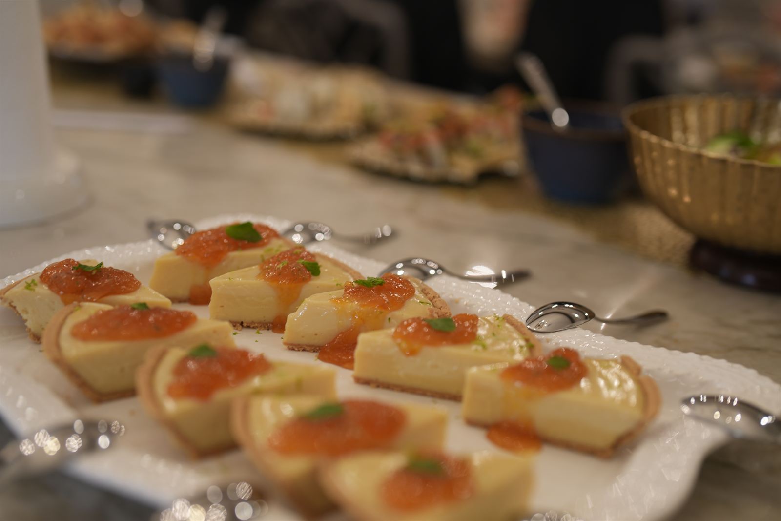 Key lime tartlets on a white platter