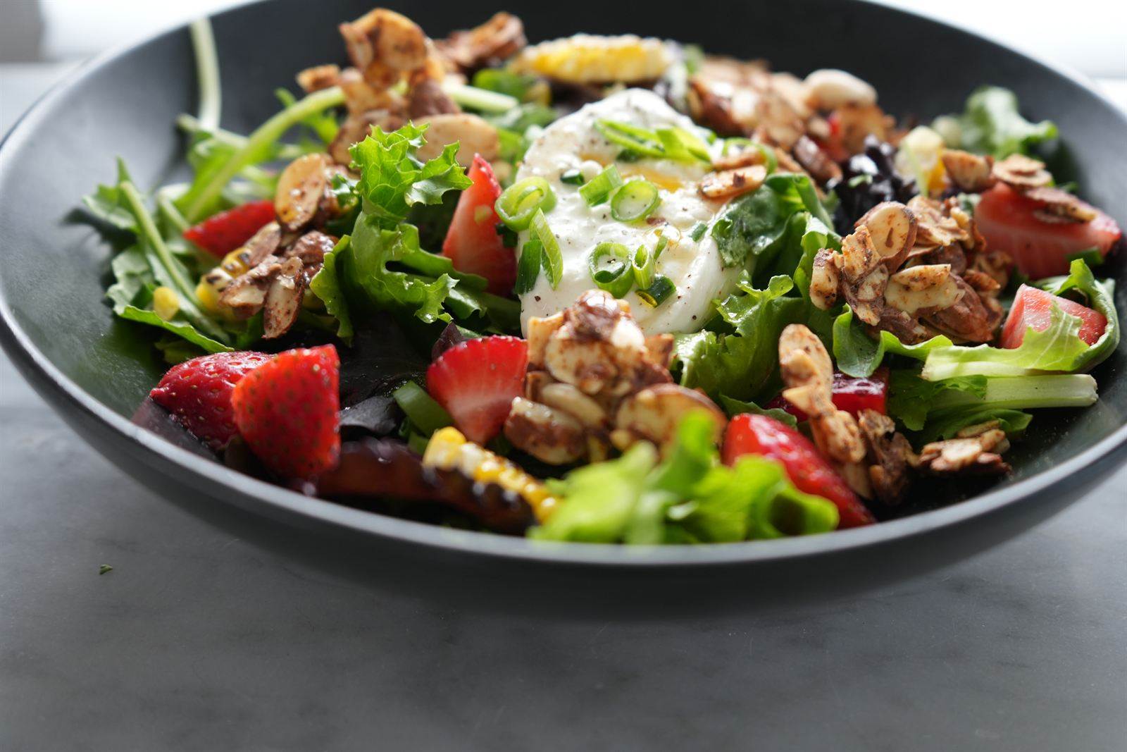 Burrata and strawberry salad with candied walnuts and greens